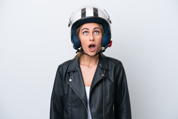 Canvas Print - Young caucasian woman with a motorcycle helmet isolated on white background looking up and with surprised expression