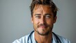 © boler - A smiling male doctor wearing a white coat