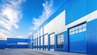 © kenza07 - Modern Blue Warehouse Exterior with Clear Sky