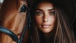 © svastix - A close-up image showing a woman with long brown hair leaning closely next to a horse, highlighting their bond and warmth in a beautiful warm light setting.