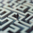 © awatch - businessman walking inside of stone maze, business concept for solving problems, seeking the solution