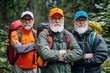 © Espresso - Three senior male hikers with beards, wearing colorful jackets and backpacks, posing confidently in a forest.