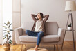 © Prostock-studio - Millennial girl relaxing at home on couch, enjoying weekends, empty space
