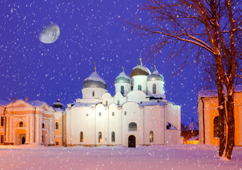 Saint Sophia Cathedral by winter night under the falling snow in Veliky Novgorod, Russia