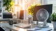 © Boonnam Burart - Modern Home Office with Desk Fan, Computer, and Indoor Plants