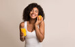 © Prostock-studio - African-american girl with orange and glass of juice over light background