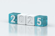 © AITTHIPHONG - 2025 concept with white and blue glass blocks showing the year in clean, modern design, symbolizing progress, new beginnings, and the future, 3d rendering