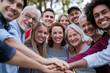 © Emanuel - Diverse group of people of all ages and backgrounds smiling together, symbolizing unity