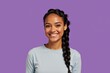 © NeedMoreMars - Happy young woman with braided hair smiling on a vibrant purple background, perfect for marketing and advertising campaigns.