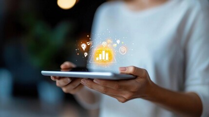 Wall Mural - businessperson holding mobile device displaying digital infographic and analytics for financial data