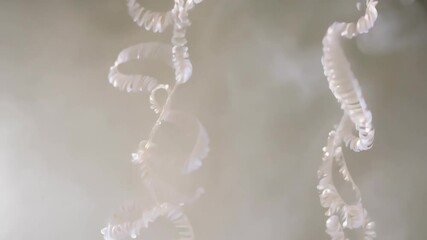 Fototapete - Elegant spirals hanging gracefully in a softly lit space create a serene atmosphere perfect for relaxation and reflection