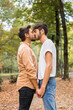 © Westend61 - Young gay couple kissing in autumnal park
