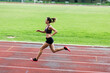 © Westend61 - Teenage runner training on race track