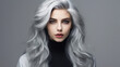 © Vicky - Portrait of a beautiful young woman with long wavy gray hair.