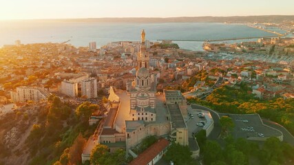 Wall Mural - Aerial view of the Notre-Dame de la Garde church at sunset in southern France.