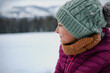 © Halfpoint - Portrait of beautiful young girl looking at snowy nature around her.
