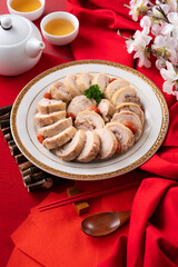 Wall Mural - Delicious sliced chicken roll soaked in Chinese wine for lunar new year's dishes.