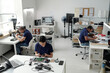 © pressmaster - Engineers Working on Electronics Prototypes in Office