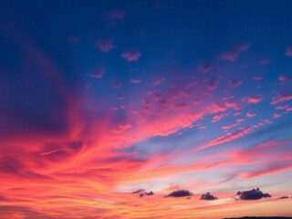 Wall Mural - Vivid orange and pink sunset sky with wispy clouds, colorful, sky, atmospheric