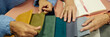 © Seventyfour - Website header shot two female designers choosing fabric colors among fabric samples on tabletop while working together on new design project at workplace, copy space