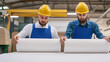 © pkproject - Workers Examining Paper and Thickness in Printing House Pre-Press