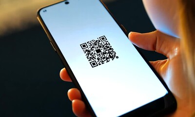 A smartphone displaying a QR code on its screen.