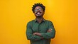 © Popelniushka - Confident and Successful African-American Male Entrepreneur Laughing with Arms Crossed in Green Casual Shirt