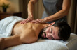 © Krystyna - A man receives a relaxing back and neck massage in a spa salon. Thai massage in the salon. Wellness massage for men.