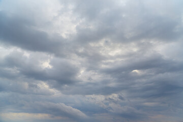 cold and dreary winter sky with thick gray-white clouds.