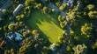 © atar - Aerial view of a park in a residential neighborhood. Concept of community, green space, and urban planning.