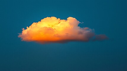 Canvas Print - Single illuminated cumulus cloud in twilight sky.