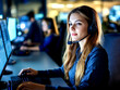 © Helen-HD - Young female technical support dispatcher engages with customers while managing multiple computer systems in a call center