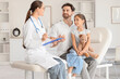 © Pixel-Shot - Pediatric doctor consultation with father and daughter, healthcare communication and child wellness checkup