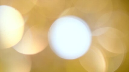 Wall Mural - holiday gold bokeh background. glitter golden blurred sparkles background. gold glitter blur dust ab