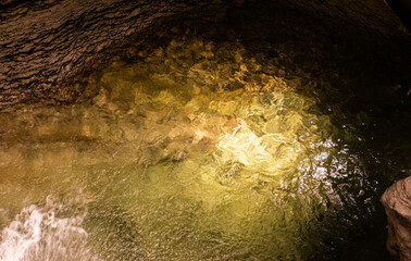 Wall Mural - Underground cave te anau new zealand water clear drops rocks stones