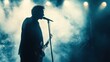 © milenialdesastudio - Musician performs in smoky stage lights.