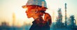 © Itsaree  - A silhouette of an industry worker in double exposure