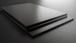 © evening_tao - Sleek Black Metal Sheets Stack