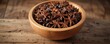 © AiGallery - Wooden bowl filled with star anise on a rustic wooden table, kitchen decor, wooden bowl, warm