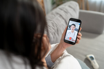 Asian young woman patient talking virtual online with medical doctor.