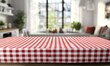 © adri - Red checkered tablecloth on wooden table in bright kitchen.