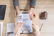 © SOMKID - Real estate agent offering rent or buying house, Contract agreement and money, Real estate inheritance concept