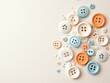 © TEN.POD - Pastel Colored Buttons and Beads on Beige Background