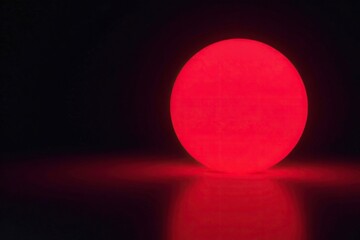 Wall Mural - glowing red sphere emitting light in darkness, glowing, isolated, sphere
