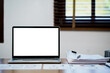 © mojo_cp - Empty white screen laptop. blank white screen. Mockup image in office.