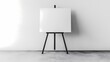 © parinja - Minimalist Blank Canvas on Black Wooden Easel Against Clean White Wall for Artistic Presentations and Creative Design Concepts