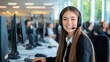 © Thitiporn - Customer Service Specialist:  A young, confident woman wearing a headset smiles warmly as she works at her computer, embodying the dedication and professionalism of customer service professionals.