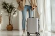 © Worawee - Traveling woman with luggage in modern interior lifestyle photography bright environment close-up perspective
