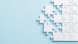 © Thitiporn - Puzzle Pieces on Blue: A close-up view of white puzzle pieces on a light blue background, forming a partial, incomplete image. The composition evokes a sense of progress, collaboration.