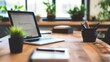 © milenialdesastudio - Modern laptop computer on a wooden desk with potted plants, stationery, and office supplies.